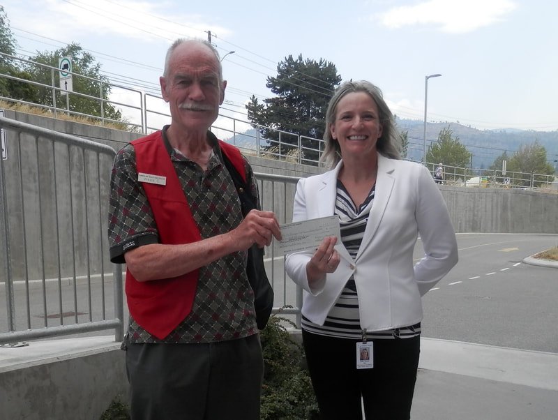 Auxiliary president Wess Campbell presents a cheque for $100,000 to the South Okanagan Similkameen Medical Foundation as a further installment towards the Summerland Health Centre xray upgrade commitment